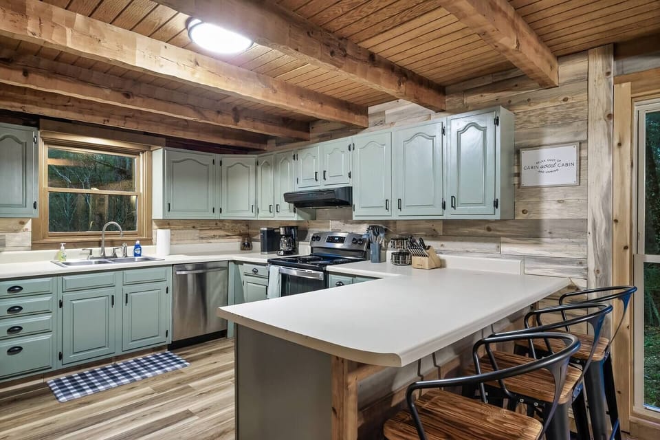 Cook a delicious meal in this open, fully stocked kitchen! Plenty of room for the whole family to help or spend time  at the eat-in dining bar while you prepare the goods!
