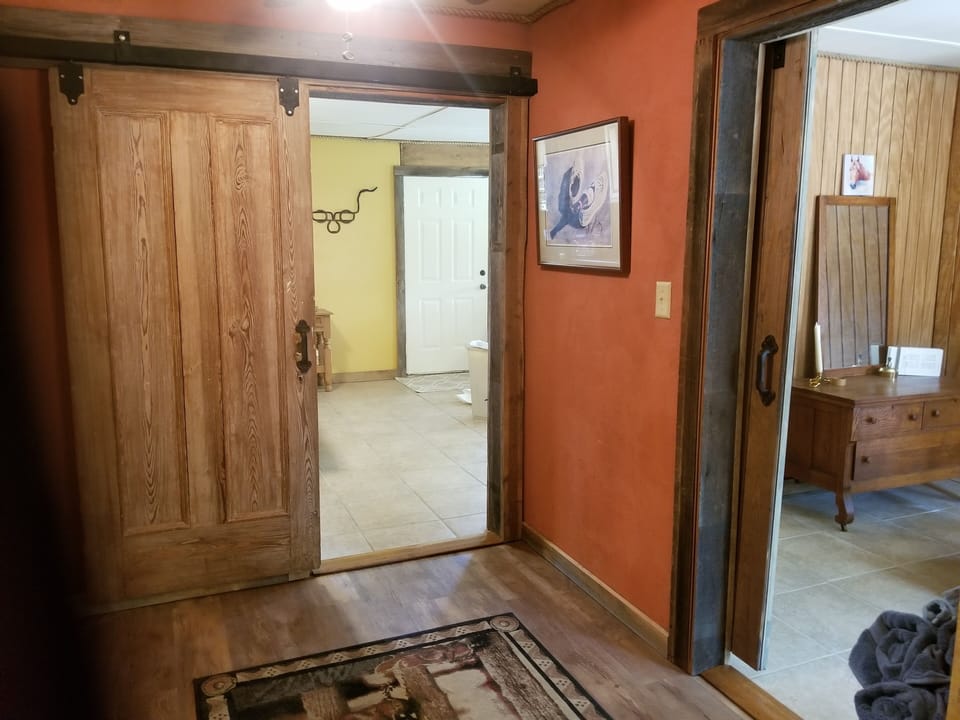 looking from bathroom to kitchen and living room