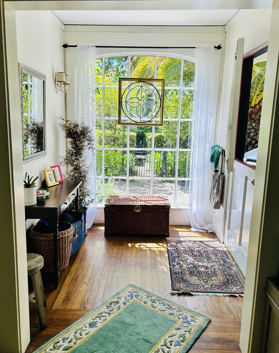 Sun-filled foyer with a charming Dutch door.