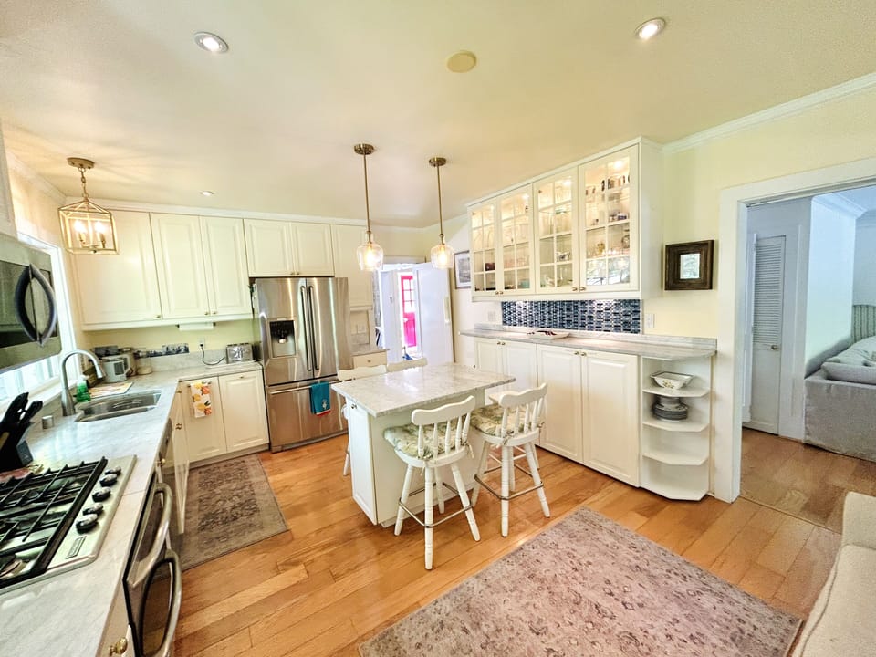 Fully stocked kitchen with gas stove, double ovens and all the comforts of home.