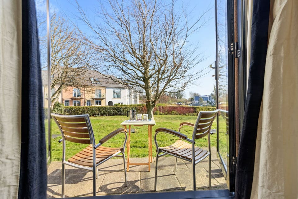 Enjoy a cup of coffee at the bistro table on the patio