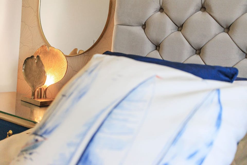 King size bed, wardrobe, bedside tables and lamps and access to patio and garden