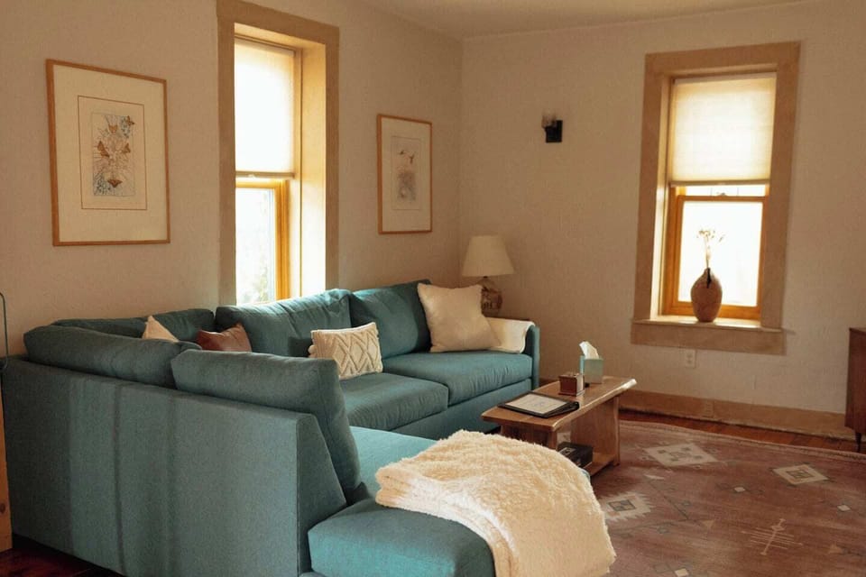 The living room has a big, comfortable couch for relaxing with friends and family. It also pulls out to a queen-size bed.