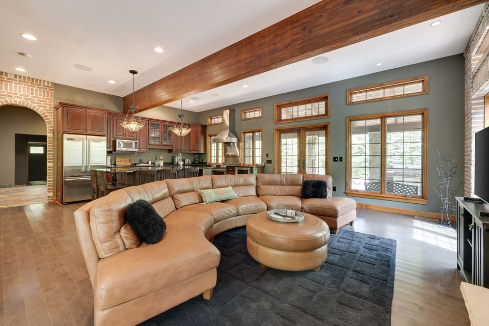 Open floor plan -20 feet oak beam across- bay windows-brick wall fireplace 