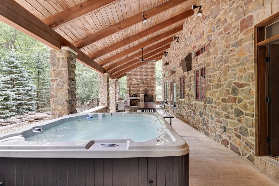 Huge hot tub on the covered stone patio