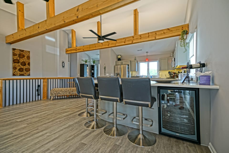 A dedicated beverage fridge for easy access close to the living and dining area.