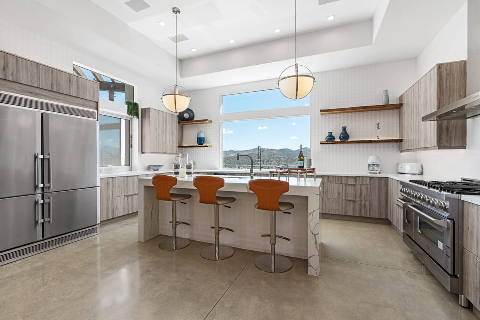 Open kitchen complete with high end appliances ready for the group's Chef
