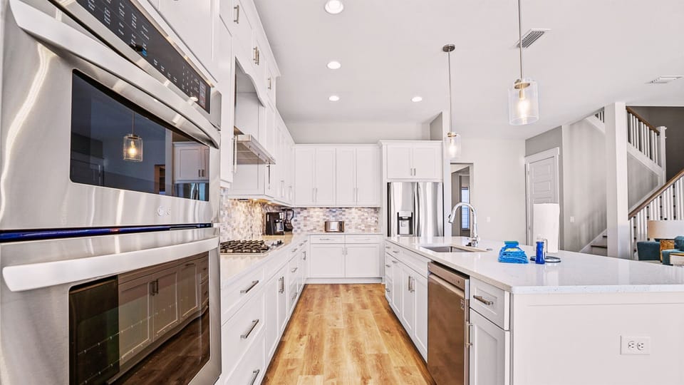 Our kitchen has all the essential cookware, full-sized stove/oven, microwave, and dishwasher.