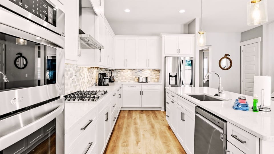 Our kitchen has all the essential cookware, full-sized stove/oven, microwave, and dishwasher.