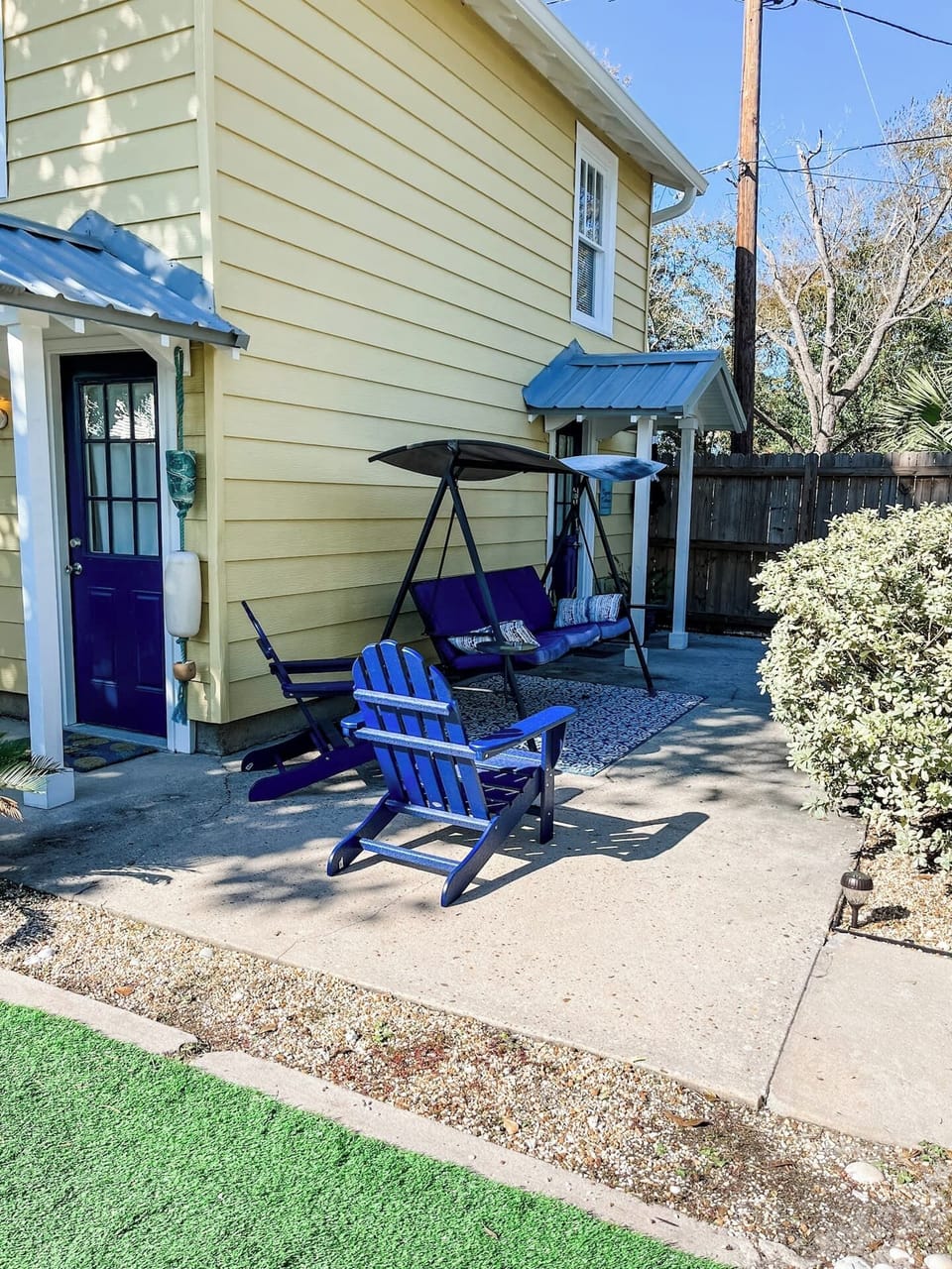 Fenced-in courtyard with outdoor seating