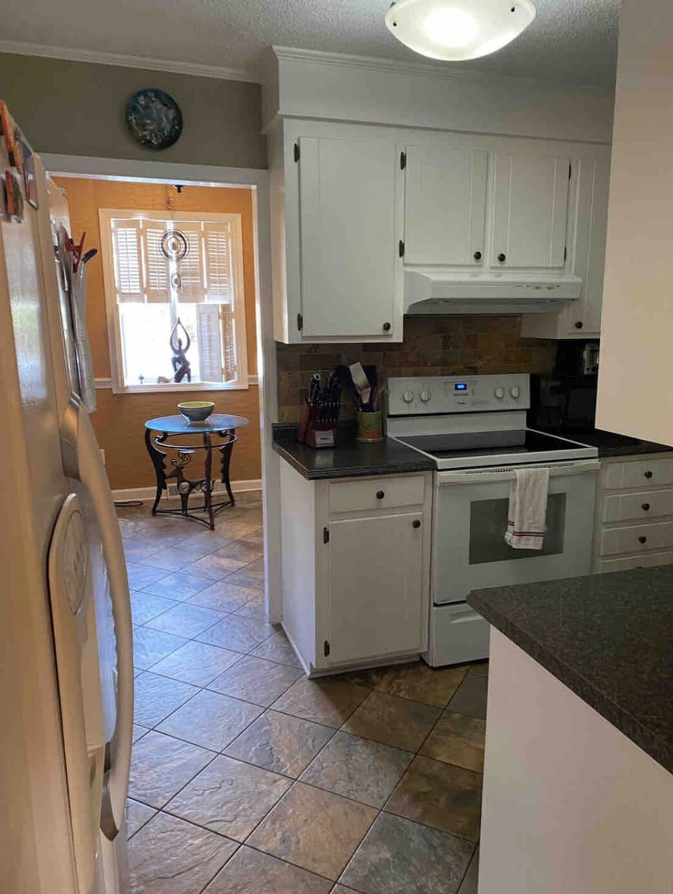 kitchen that leads into coffee/sunroom