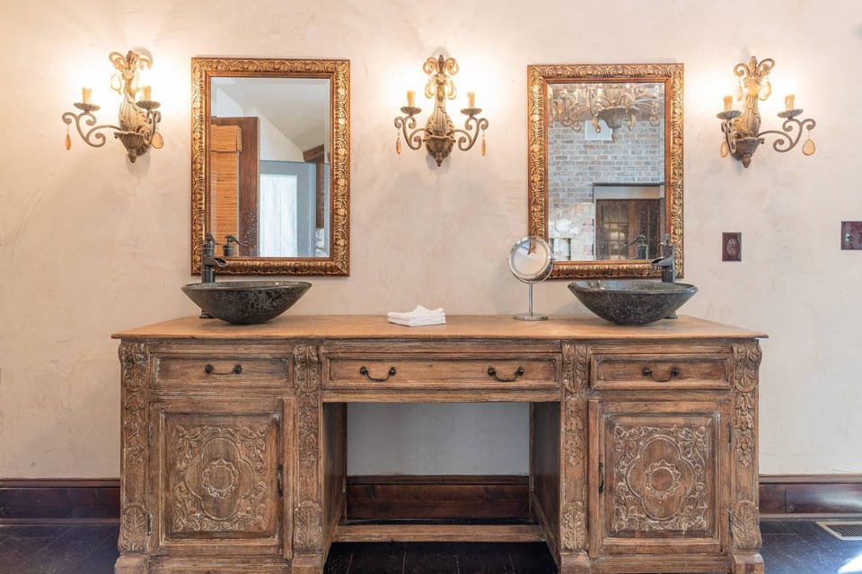 The finest fixtures are throughout the home as seen here with the dual vanities in the Master bath.