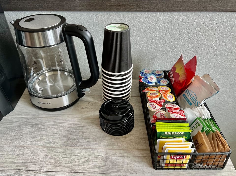 Coffee Bar Amenities ~ Variety of teas, creamers, sweeteners, and to go cups.
