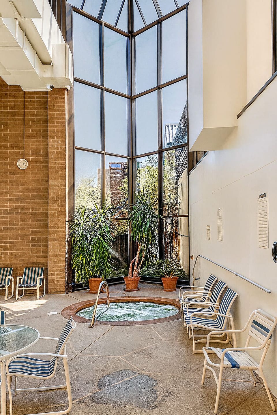 Soak and relax in the indoor whirlpool atrium oasis.