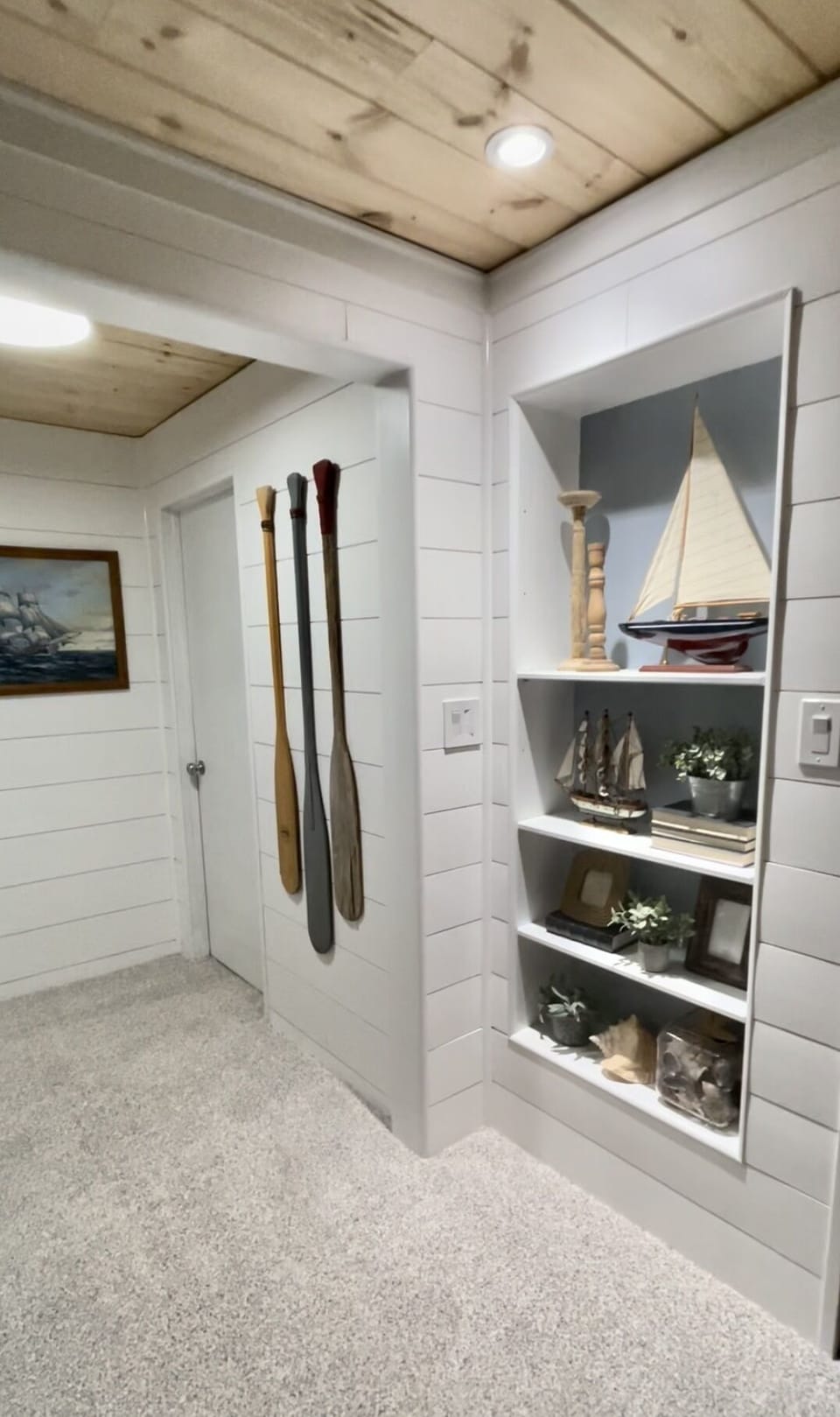Hallway leading to the stairs. Far door shown is to the downstairs bedroom.