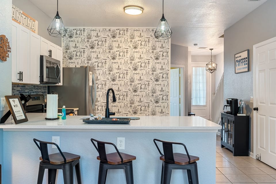 Modern full kitchen with bar seating for 4
