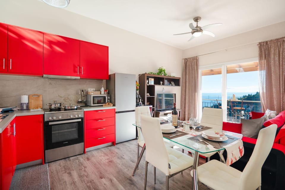 Colourful kitchen and living area with sea views
