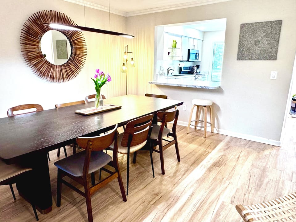 Dining table seats 8 at this Rehoboth Beach vacation rental — open-concept layout perfect for group gatherings on the Delaware shore.