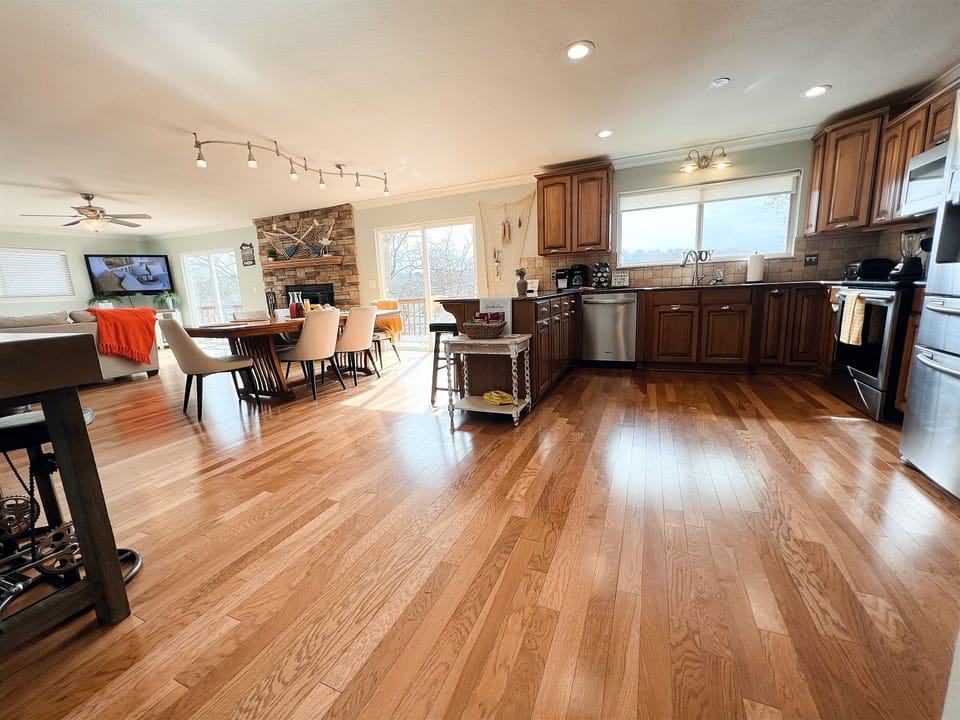 Walk inside and find your open concept kitchen, dining, and living rooms with views of Lake Avalon.