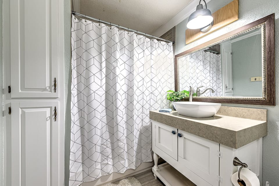 Head down the hall to our guest bathroom complete with Shower/Tub Combo.
