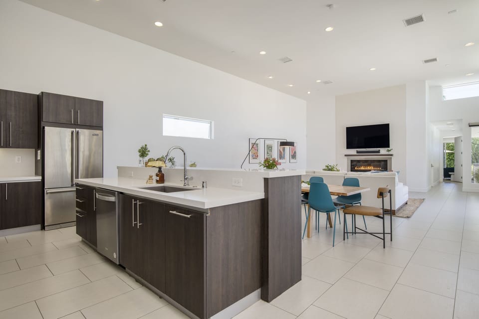 Kitchen looks toward the living and dining areas.