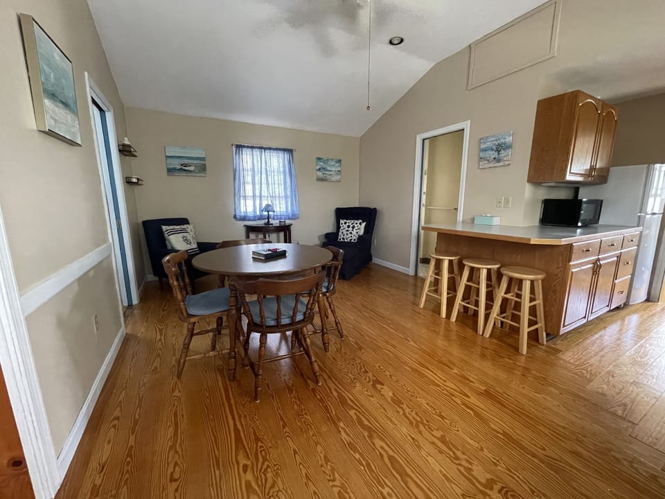 Great gathering place in a fully applianced eat in kitchen with sitting area