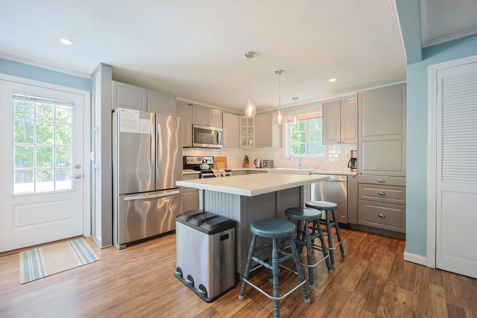 The fully equipped kitchen with stainless steel appliances.