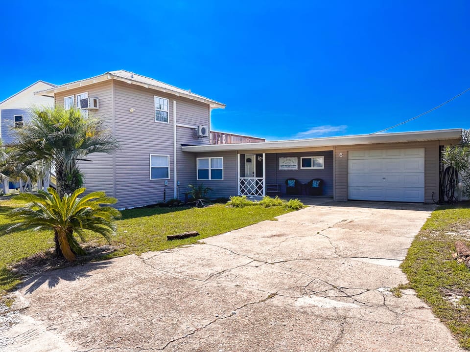 Tarpon Point Beach House Front of House. Bungalow style. Front porch.