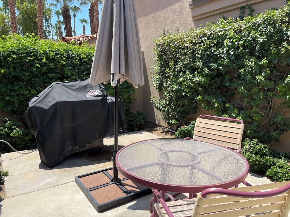 Patio #2, off the 2nd Bedroom: Table, chairs, umbrella and state of the art BBQ