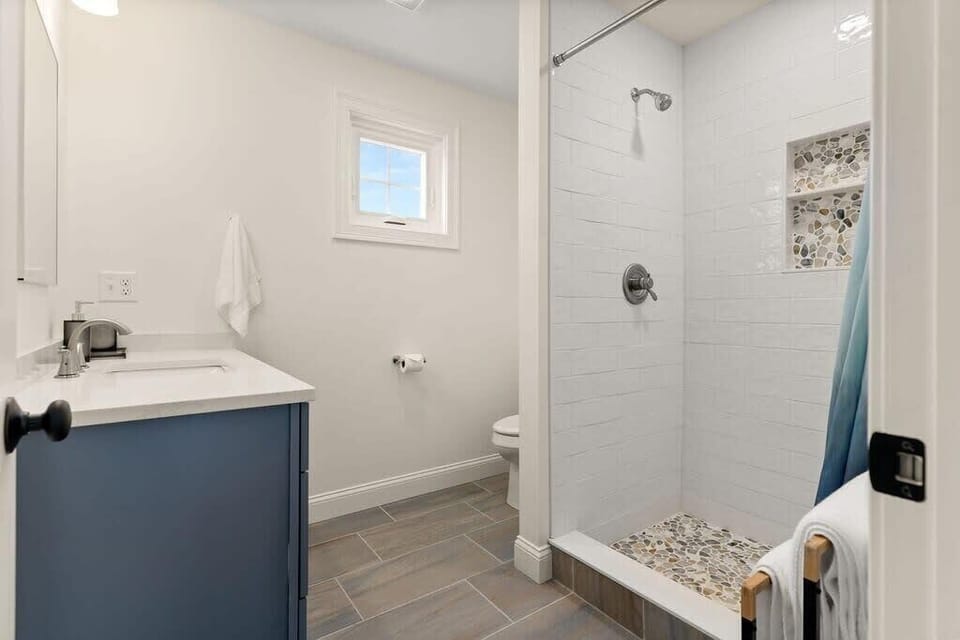 Master bedroom ensuite with heated floors and tiled shower! Clean towels provided