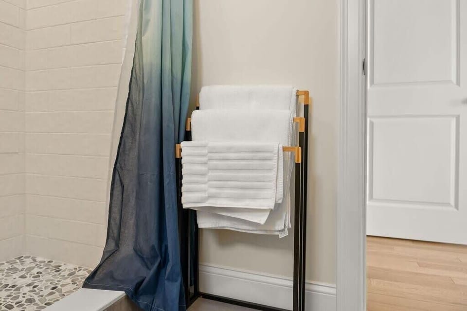 Master bedroom ensuite with heated floors and tiled shower! Clean towels provided