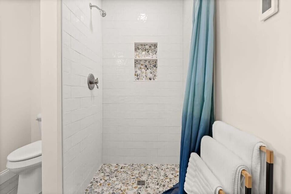 Master bedroom ensuite with heated floors and tiled shower! Clean towels provided