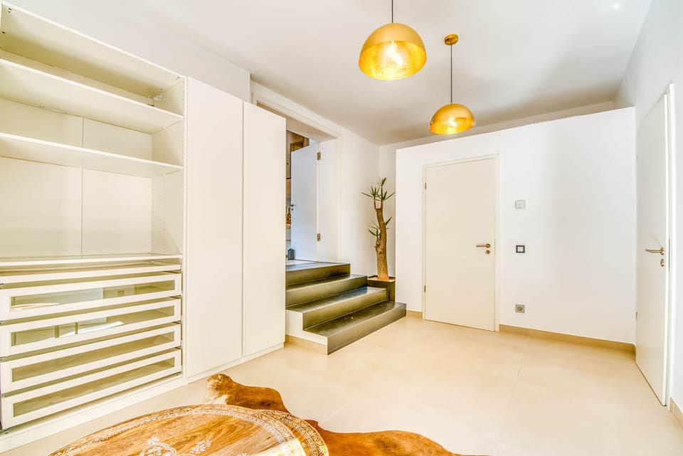 Hallway with glass pendant lights