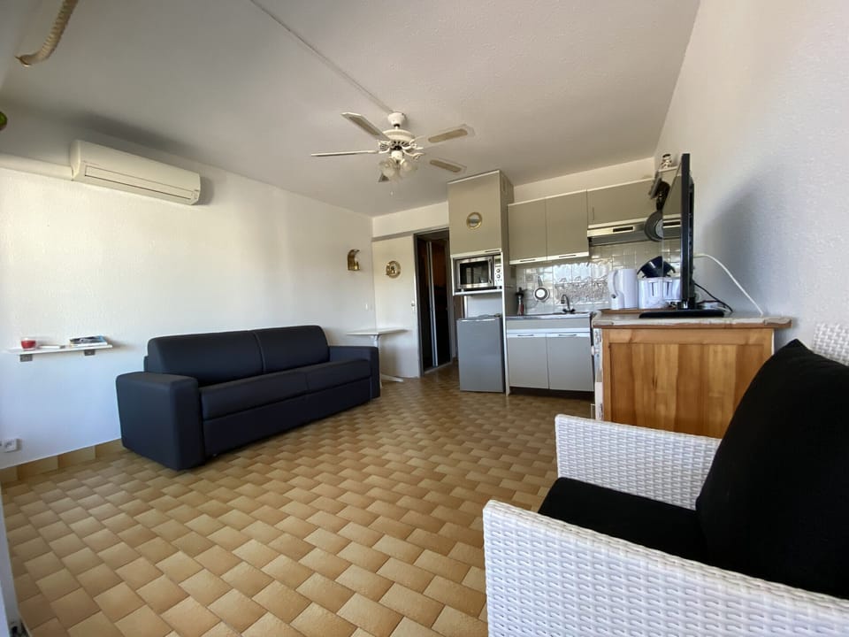 Spacious living room with a double sofa bed, and fully equipped kitchen