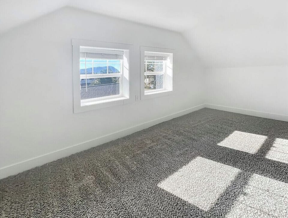 Large upstairs bedroom, south-facing windows, with view of Tillamook Head