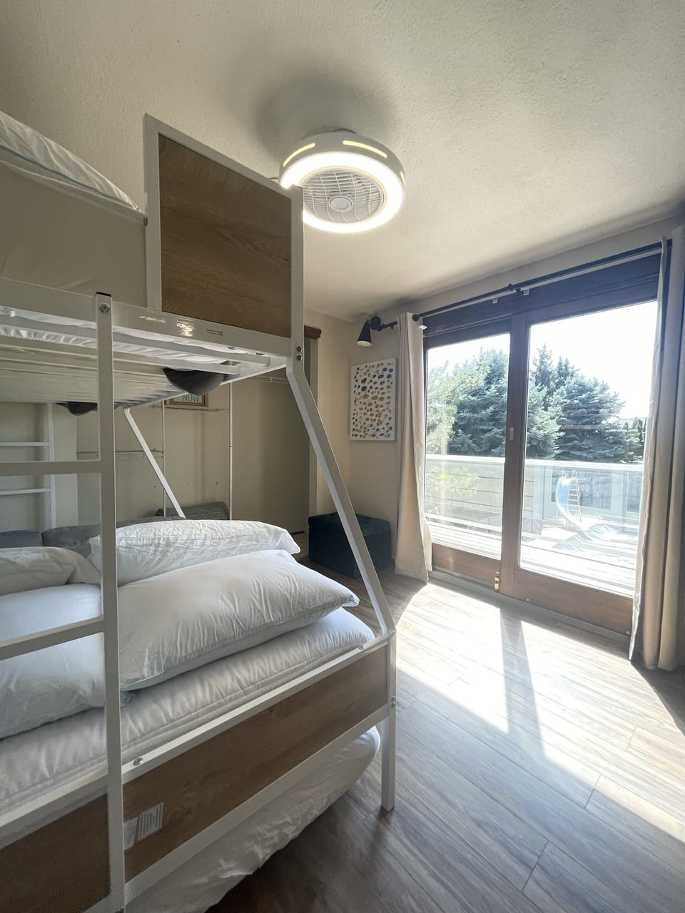 The Bunk Room closet, slider, storage ottoman. 