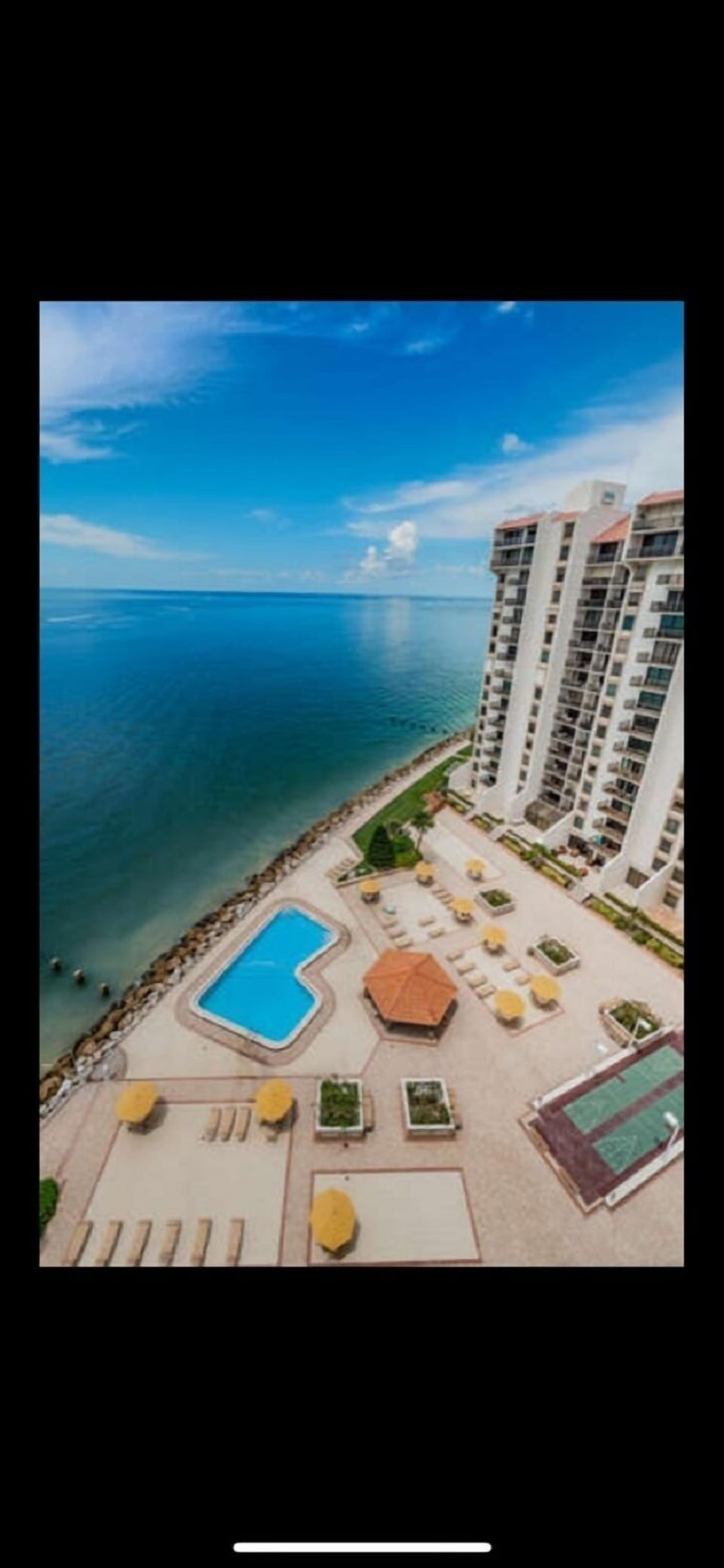 Balcony overlooks pool & Gulf of Mexico.  Dolphin & Manatee sightings here
