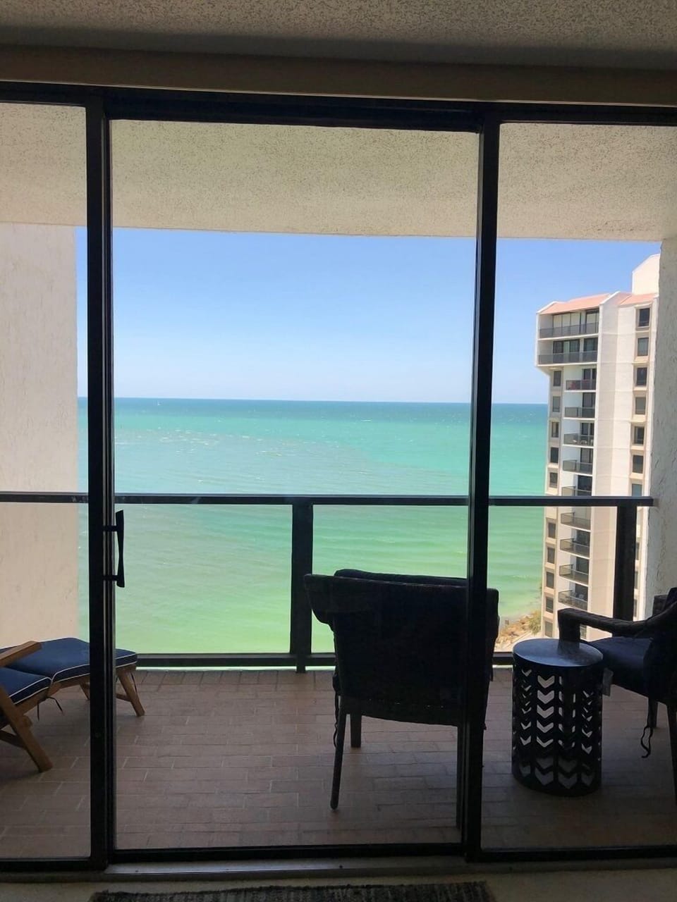 Family Room looking out onto the Balcony.  New furniture in family room. No pic.