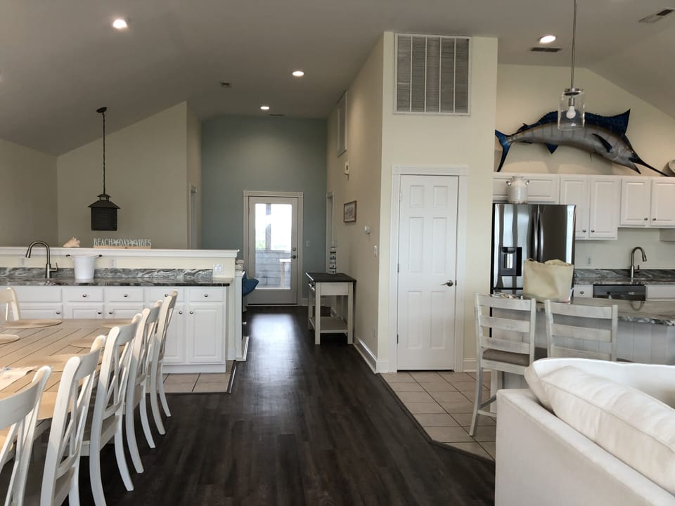 Wet bar with ice maker in dining area.