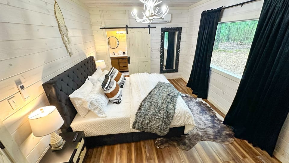 Cozy king bed in the casita, complete with a private bathroom - perfect for a peaceful night's sleep for two.
