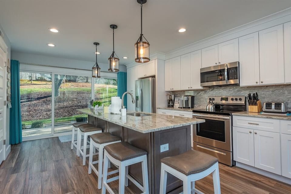 This kitchen, with it's stainless steel and granite counter tops, is asking you to make your specialty.