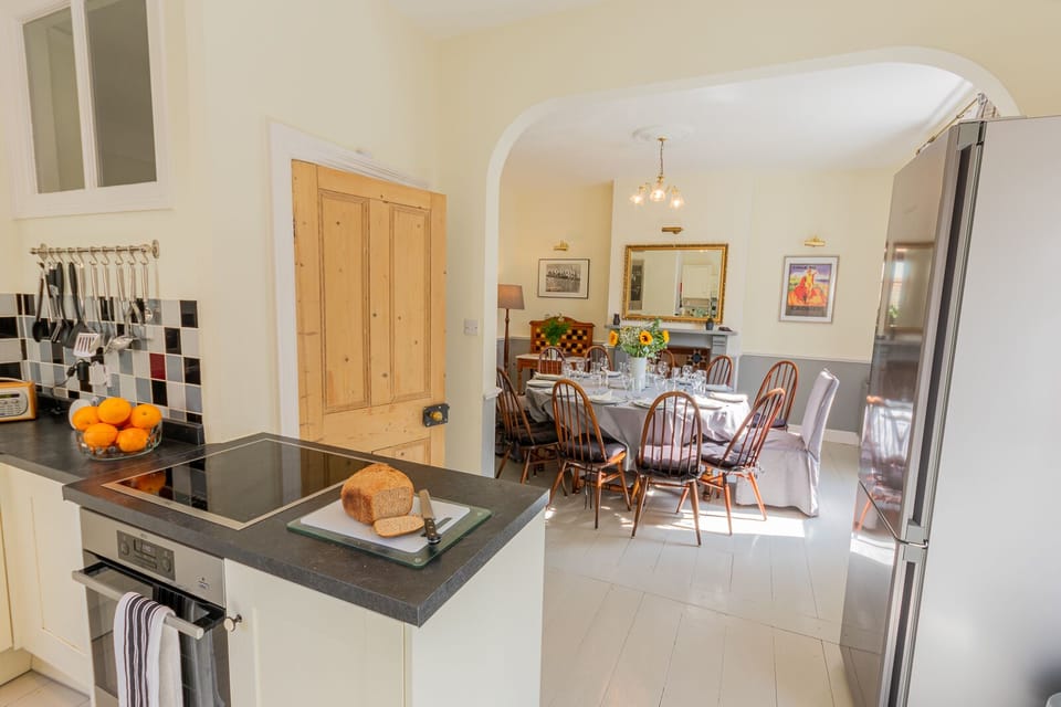 The Dining Room and Kitchen are linked through an archway.
