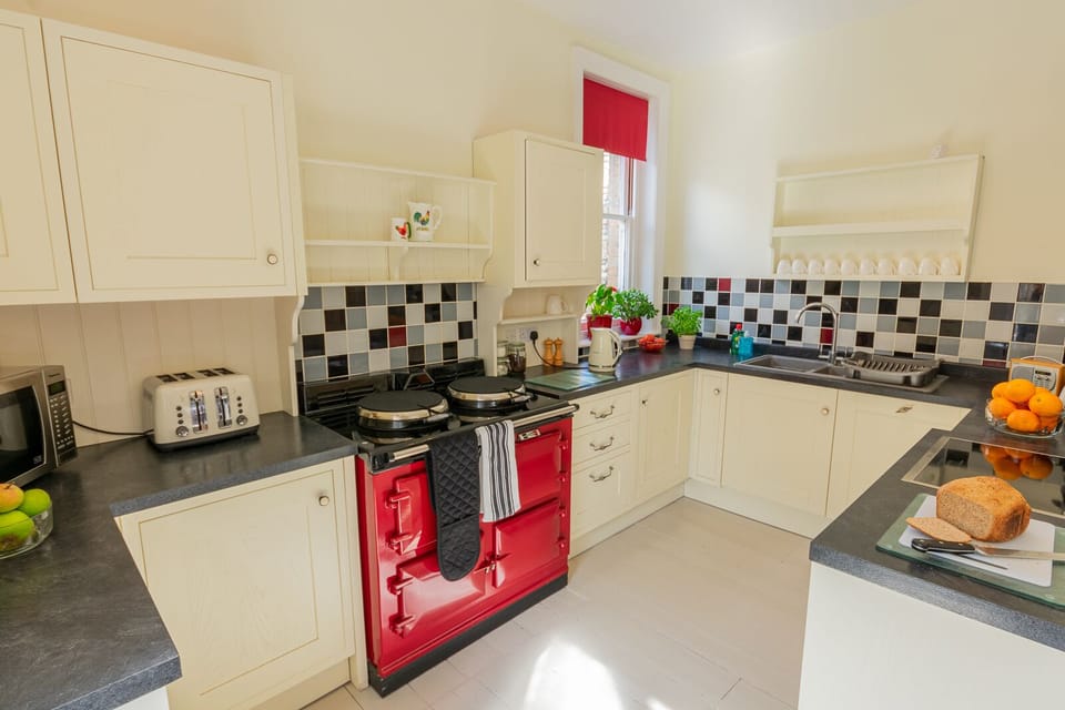 The kitchen has electric oven, induction hob, dishwasher and AGA (runs Oct-May)