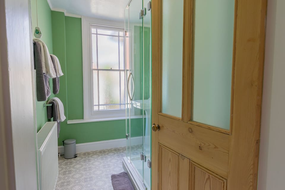 Upstairs family shower room with rain shower