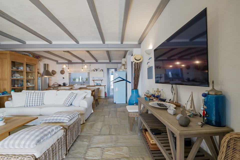 The living room, dining area and fully equipped kitchen