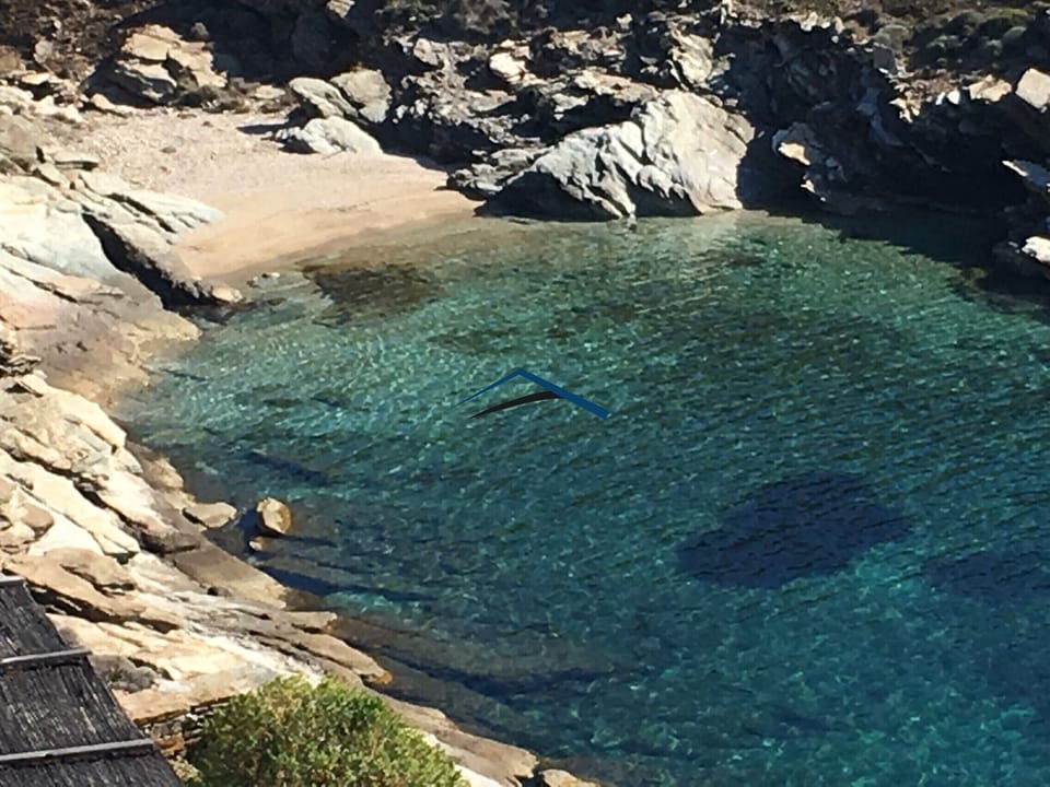 The small sandy beach near the villa