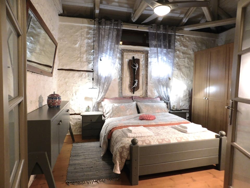 The large master bedroom with a queen's size bed and a six-door closet