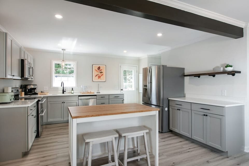 Well stocked kitchen with plenty of space for gathering.