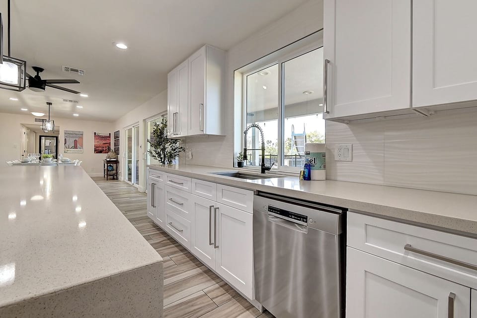 Kitchen has views of the sunny south facing acre estate (6x larger than most)