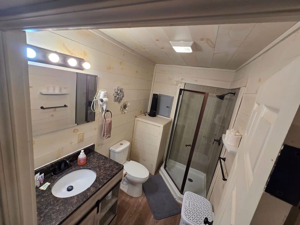 Bathroom with vanity and glass shower